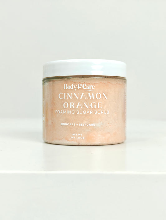 Jar of Cinnamon Orange Foaming Sugar Scrub by Body & Care Cosmetics on a white background